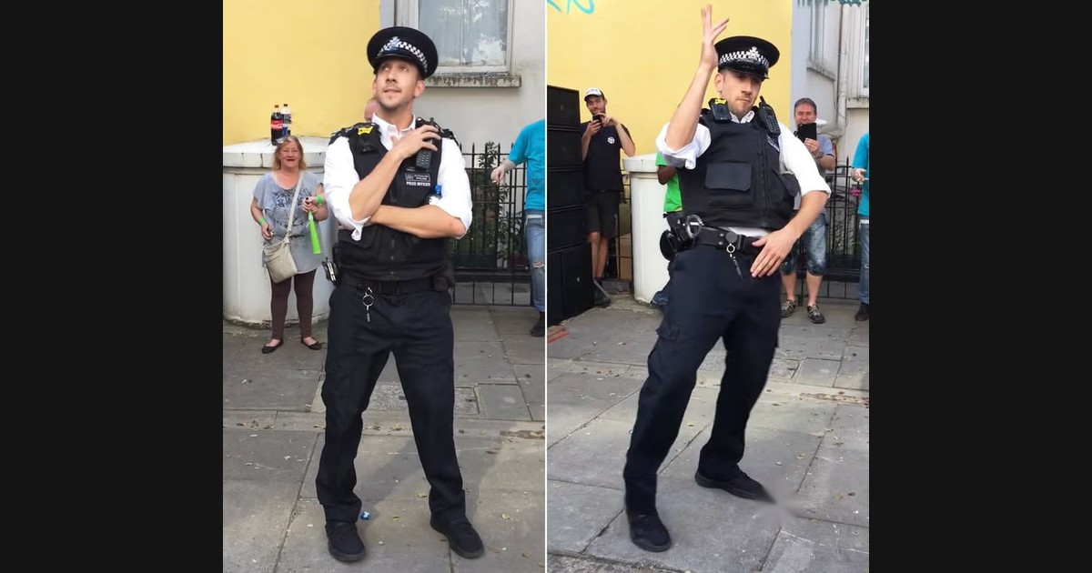 A Dancing Police Officer Becomes Part of the Notting Hill Carnival Crowd